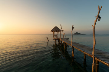 Obraz premium Wooden pier between sunset in Phuket, Thailand. Summer, Travel, Vacation and Holiday concept.