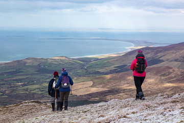 Hiking on the Dingle Peninsula along the Wild Atlantic Way looking north towards the Maharees and Kerry Head in County Kerry, Ireland