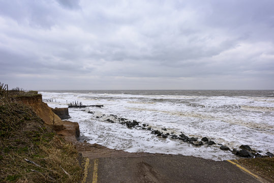 UK, HAPPISBURGH - 18 MAR 2018: Coastal errosion taking place duirng a winter storm. Many homes have recently been lost in this community due to coastal erroasion.