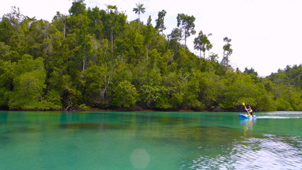 Kayaking in a tropical river, West Papua, Raja Ampat, Indonesia 