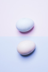 Fototapeta na wymiar Colored eggs opposite color over opposite background, conceptual composition for easter 