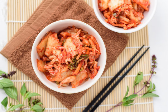Kimchi cabbage (Korean food) in a bowl, top view