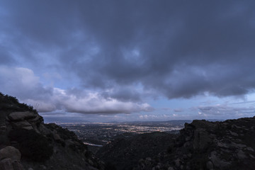 Naklejka na ściany i meble Stormy winter sky after sunset above the San Fernando Valley in Los Angeles California. Shot from Rocky Peak Park in the Santa Susana Mountains near Simi Valley. 