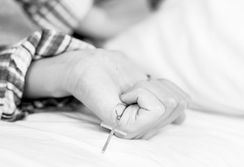 Closeup of a rosary in woman hand