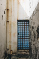 Fototapeta premium Rustic door and exterior of a house in Penang