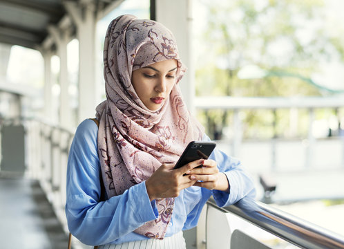 Islamic Woman Texting Messaging On The Phone