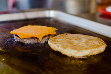 Fast food hamburgers take-away production cooking background
