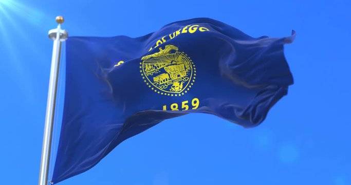 Flag of american state of Oregon, region of the United States, waving at wind - loop