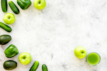 Cucumber, pepper, apple, avocado. Vegetables for greeny organic smoothy for sport diet on stone background top view mockup