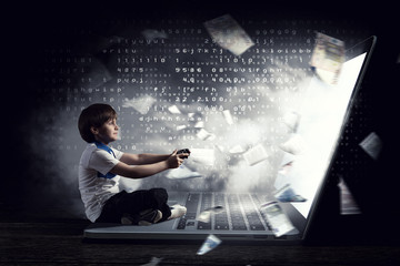 Fototapeta premium Boy playing a video game. Mixed media