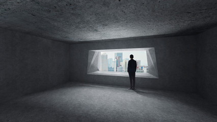Fototapeta na wymiar Thoughtful businessman standing in empty space concrete room with bright window and cityscape view . Mixed media .