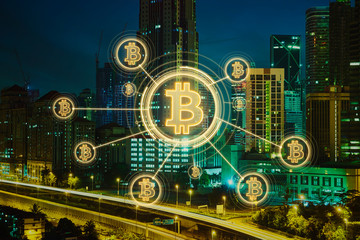 Fototapeta na wymiar Bitcoins and blockchain network connection with night city background .Electronic money ,blockchain transfers and finance concept.