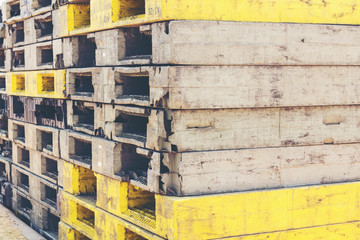 Black and yellow pallets are arranged for use.