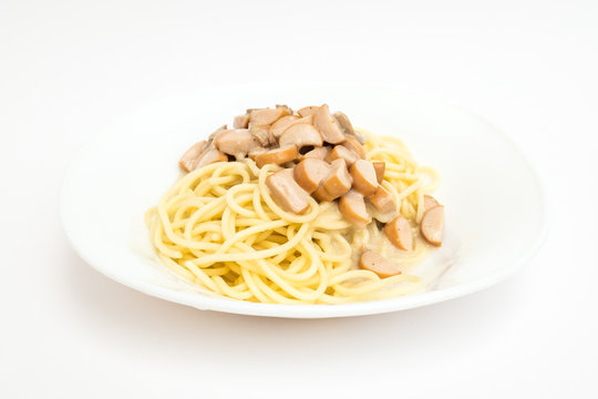 Cooked Spaghetti Carbonara With Sausage On The White Ceramic Plate