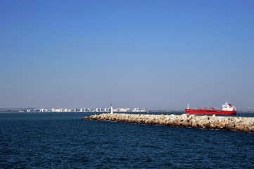 Ships in the harbor of the seaport of Cadiz on the shores of the Cadiz Bay of the Atlantic Ocean.
