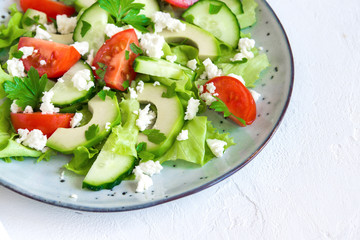 Avocado, feta and vegetables salad
