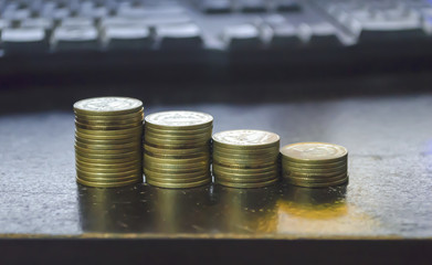 gold coin set isolate on keyboard background