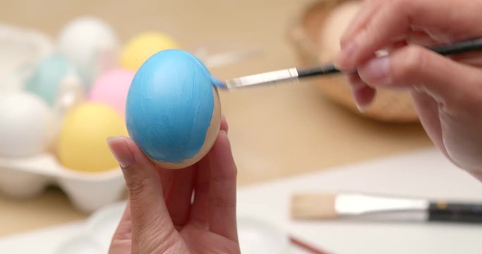 Painting on egg for Easter holiday