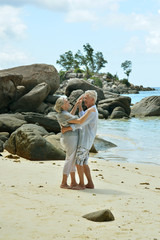 elderly couple rest at tropical resort