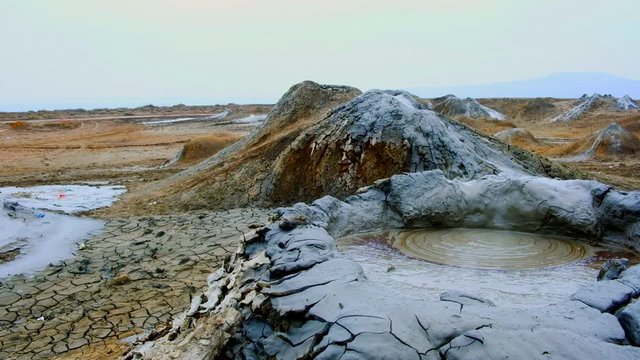 Boiling muddy bubbles in crater of mud volcano of Gobustan near Baku, Azerbaijan, v08