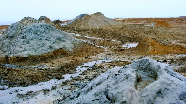 Boiling muddy bubbles in crater of mud volcano of Gobustan near Baku, Azerbaijan, v09