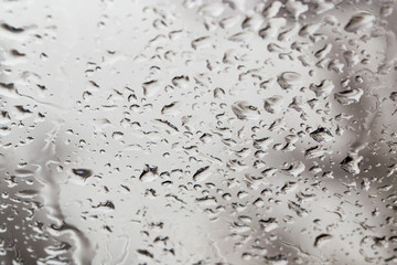Rain drops on the car glass as a background