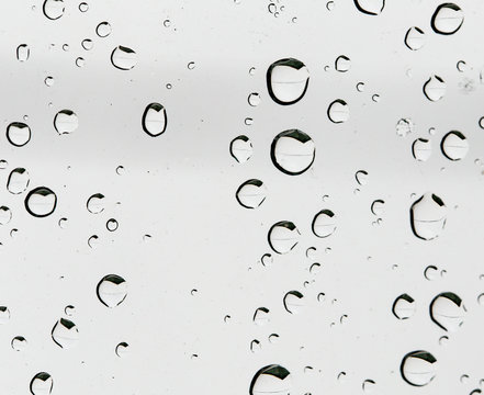 Rain drops on the car glass as a background