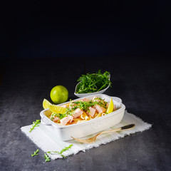 Salmon with penne noodle and arugula