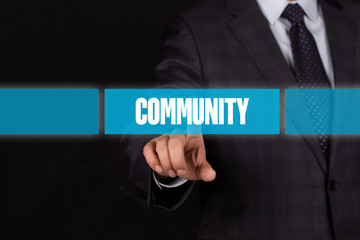 Hand pushing on a touch screen interface-COMMUNITY button