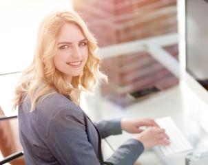 business woman typing on computer keyboard