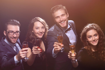 happy young people with a glass of wine.