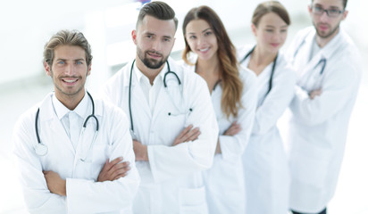 Fototapeta premium medical team standing with arms crossed on a white background