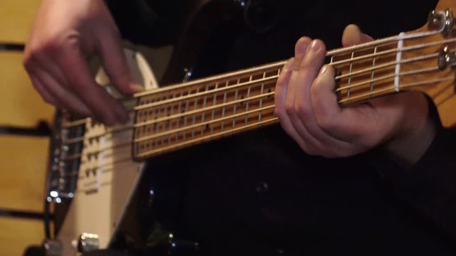 Bass guitar.Lessons of guitar playing.     