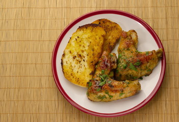 chicken winggs and tosts on a plate 