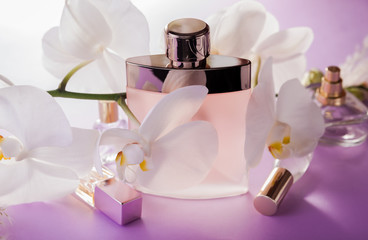 Organic cosmetics concept. Bottles of perfume with orchid