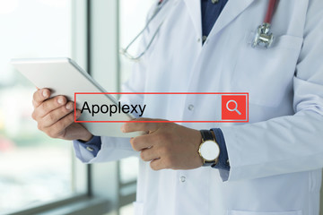 DOCTOR USING TABLET PC SEARCHING APOPLEXY ON WEB