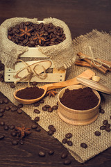 Fototapeta na wymiar Coffee beans in a wooden box, buckwheat and cinnamon sticks.