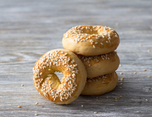 A stack of easter cookies with sesame seeds on a wooden table, selective focus. Traditional Greek Pastries