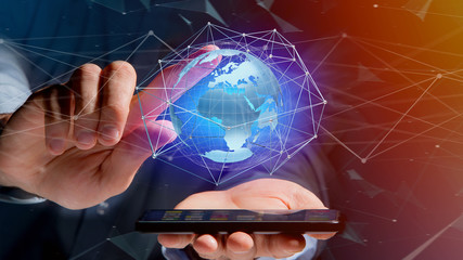 Businessman using smartphone with a Connected network over a earth globe concept on a futuristic interface - 3d rendering