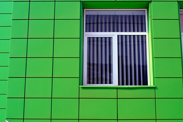 Green tile wall with window
