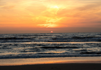 Fototapeta premium Scenic View Of Sea Against Orange Sky