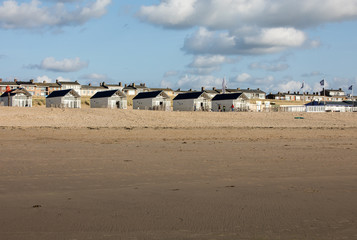 Row white beach houses at the Dutch coast in Katwijk, Netherlands
