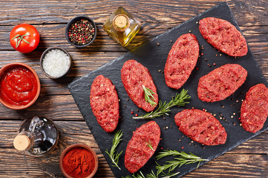 fresh raw salisbury beef steaks, close-up - Powered by Adobe