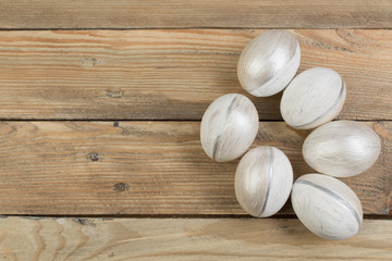 Happy Easter. Painted eggs on wooden table. Top view.
