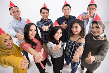 party asian people showing thumb up