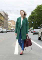  girl stands on the road among the cars, the girl in the city