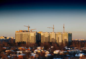 Multiple cranes building site background