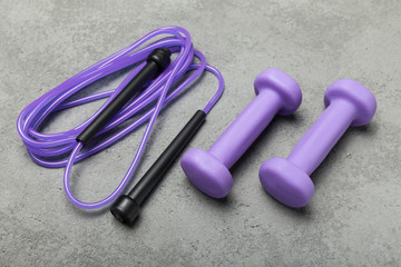 Sports equipment on a gray table for sports. Sports accessories.