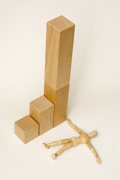 Loser - a figure of a wooden man, who fell from the high pedestal (isometric view)