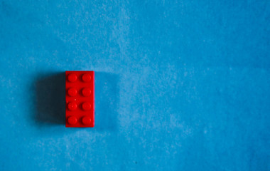 a red cube on a blue background. minimalism